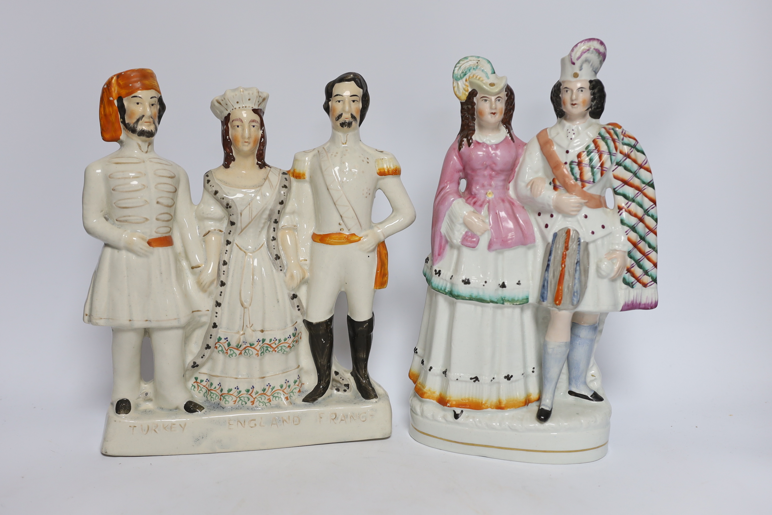 Seven 19th century Staffordshire flat back figure groups, including figures of Milton, Nelson, a pair of dancers, etc., tallest 29cm